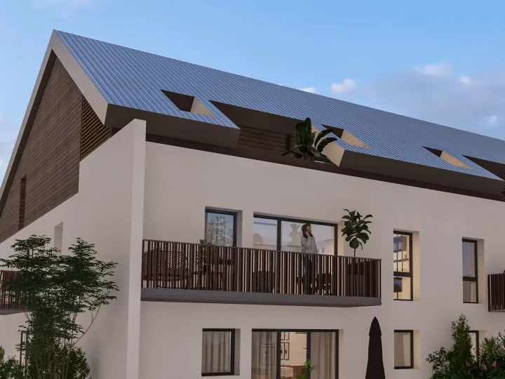 Un immeuble de Rodbaek Village, avec son pignon habillé de bois et son grand balcon